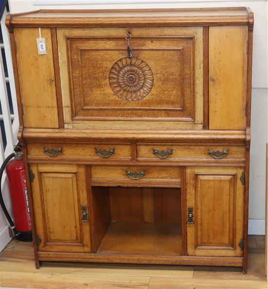 A Victorian Arts & Crafts oak writing cabinet by Maple & Co W.107cm